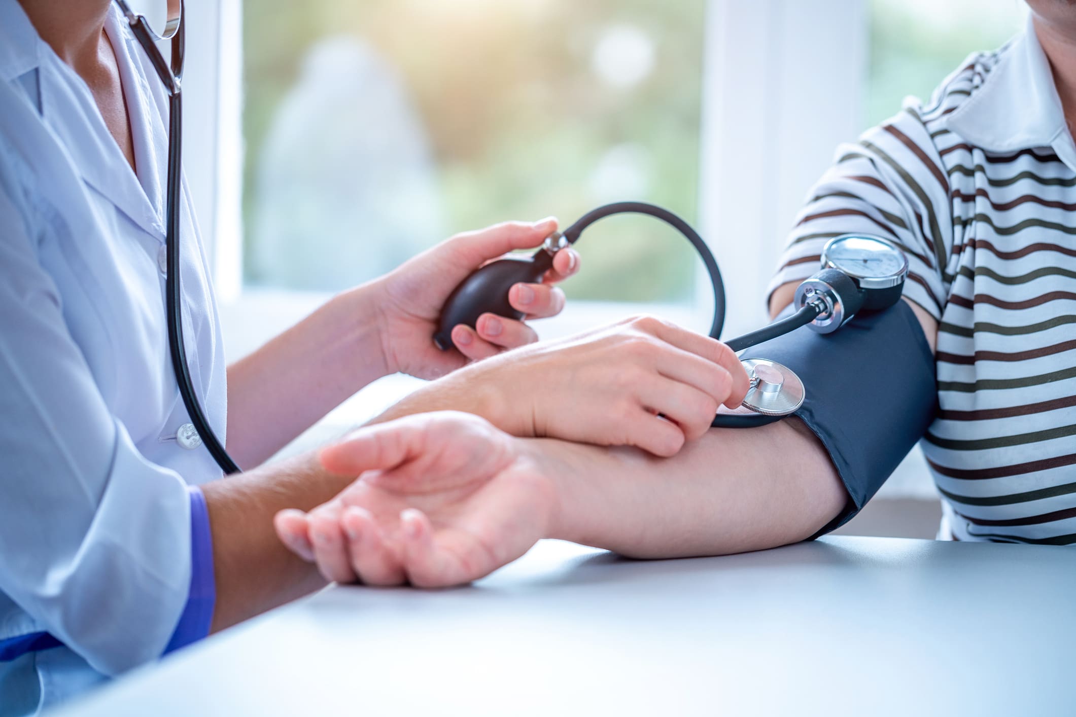 Blood pressure test at medical clinic