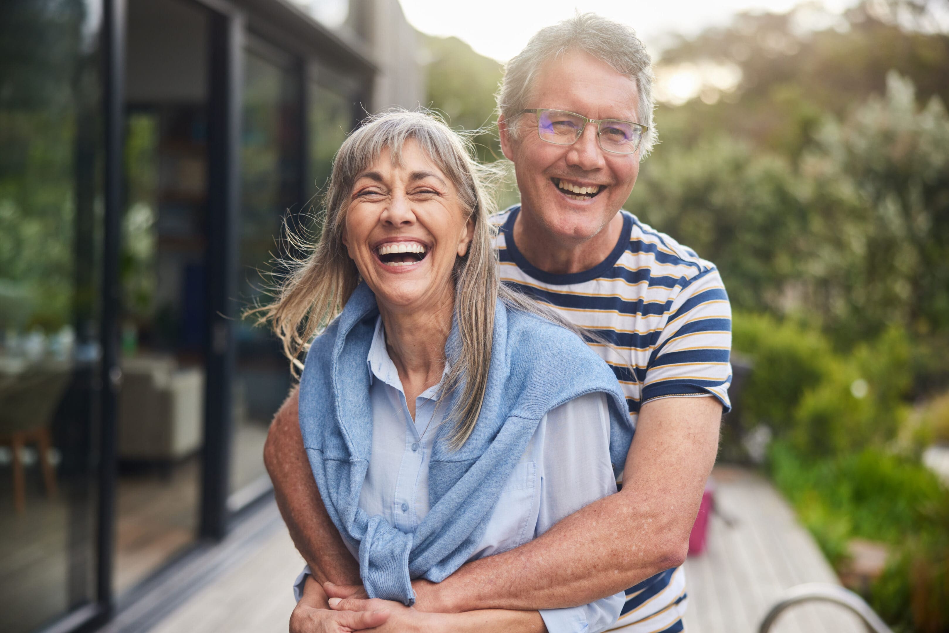 Joyful older couple laughing together
