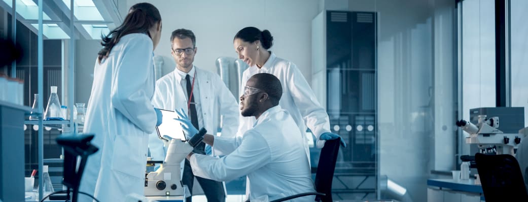 Group of lab professionals collaborating