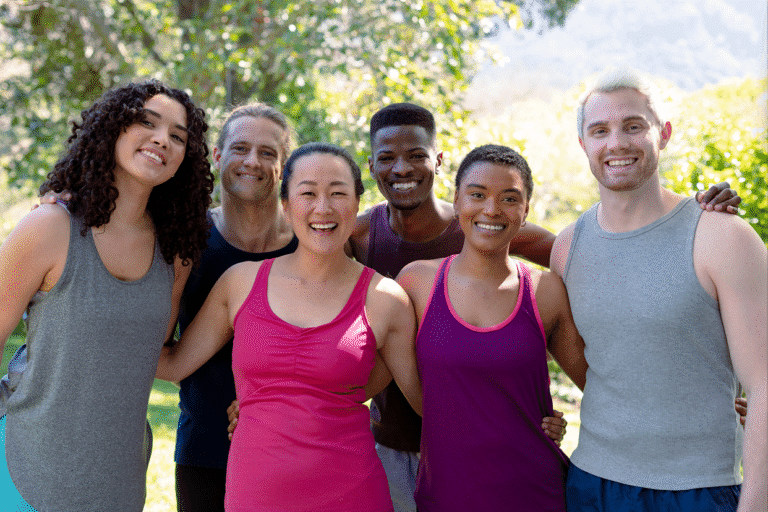 Diverse group posing together outside