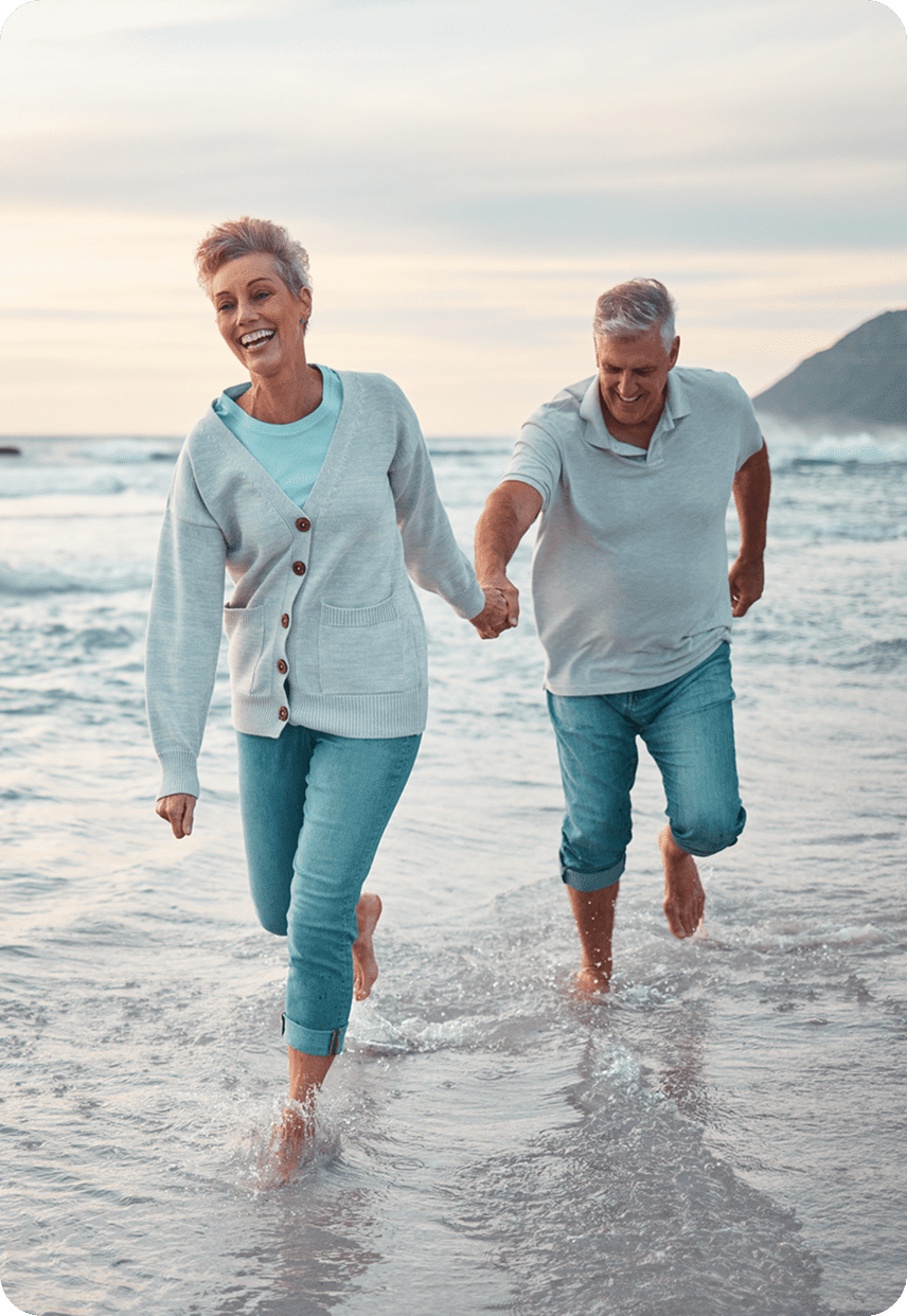 Seniors enjoying a beach stroll
