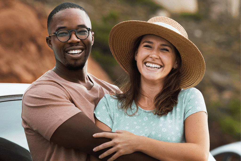 Smiling couple embracing outdoors